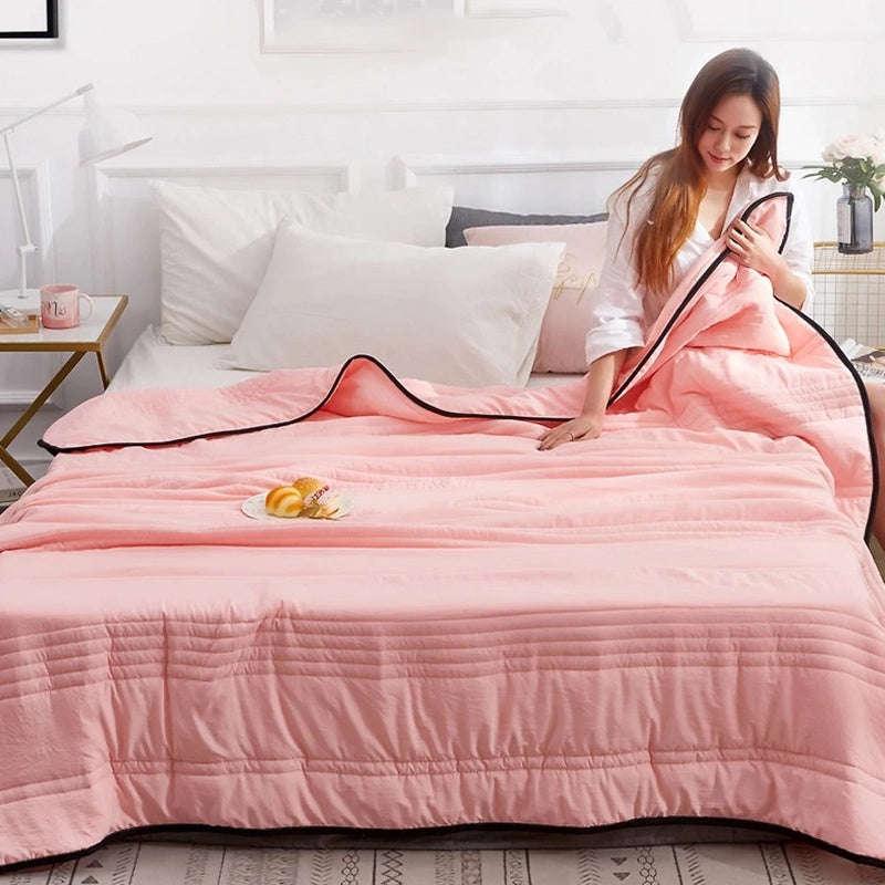 Cooling blanket folded to show its size and texture
