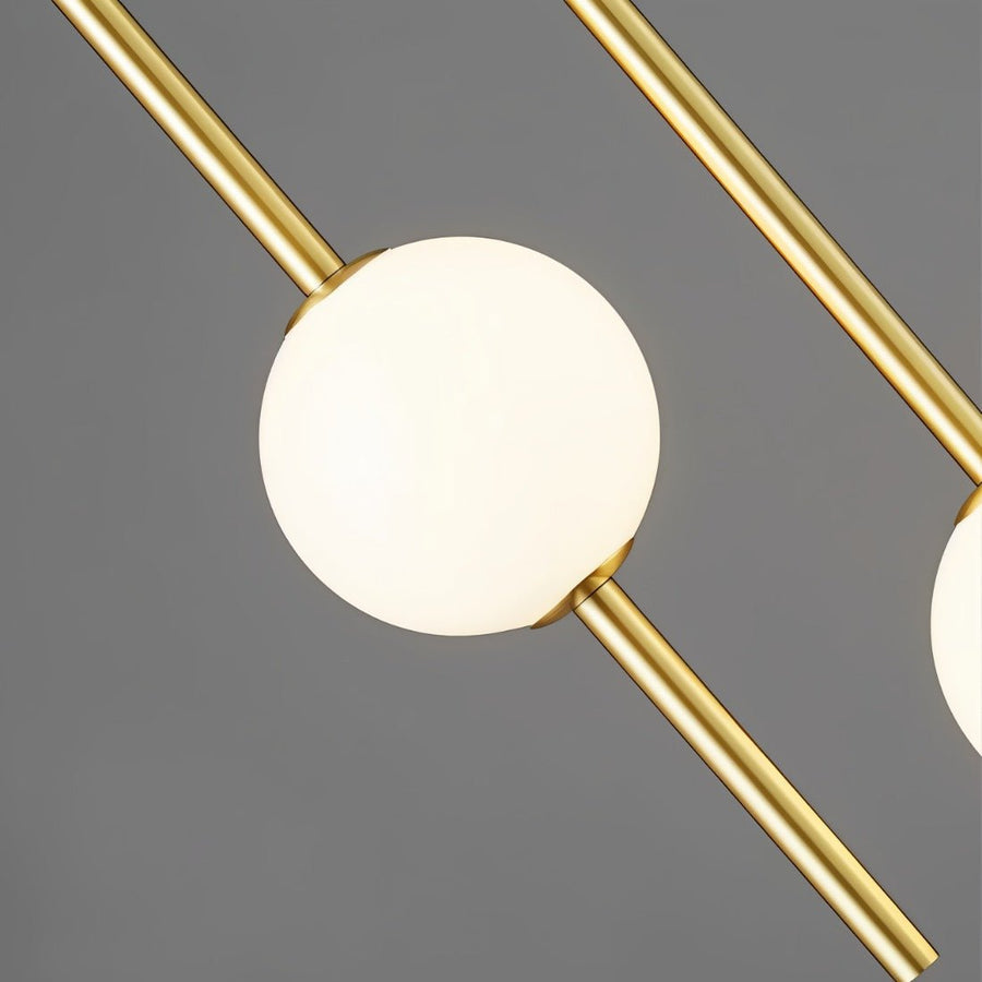 Brass globe pendant light in a modern living room