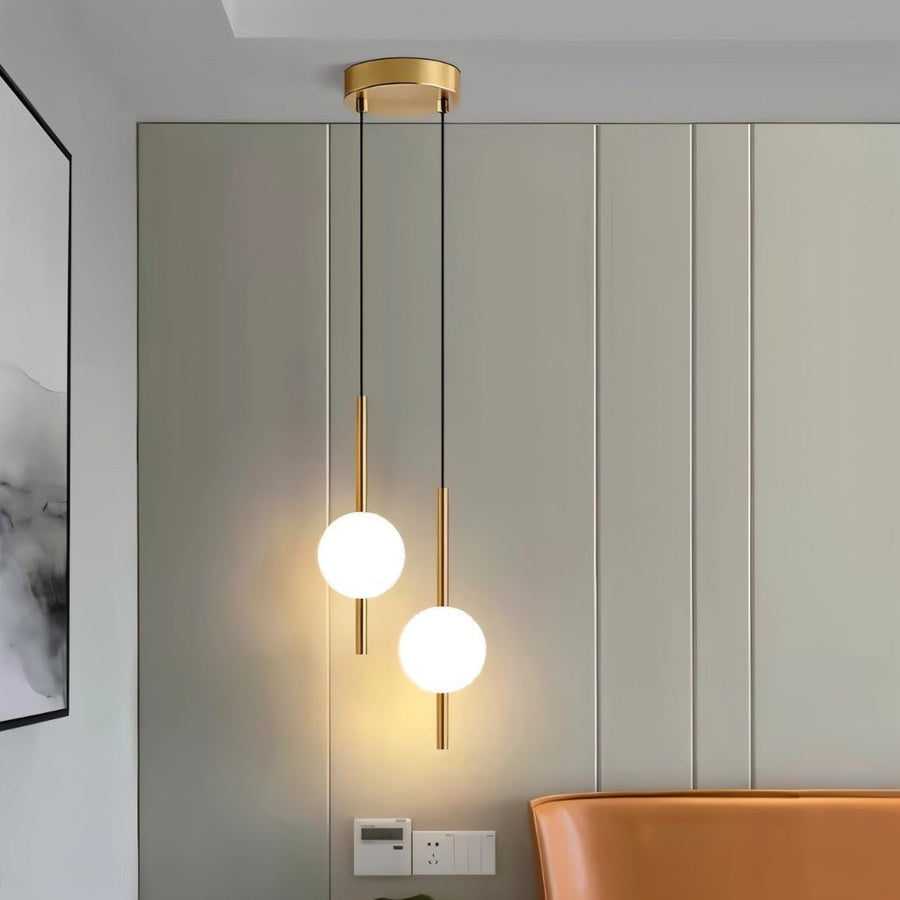 Vertical globe pendant light in a dining room setting