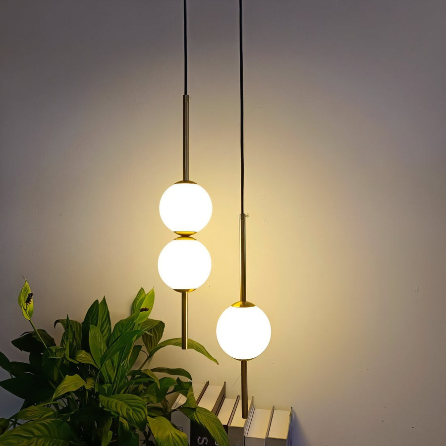 Globe pendant light installed above a kitchen island