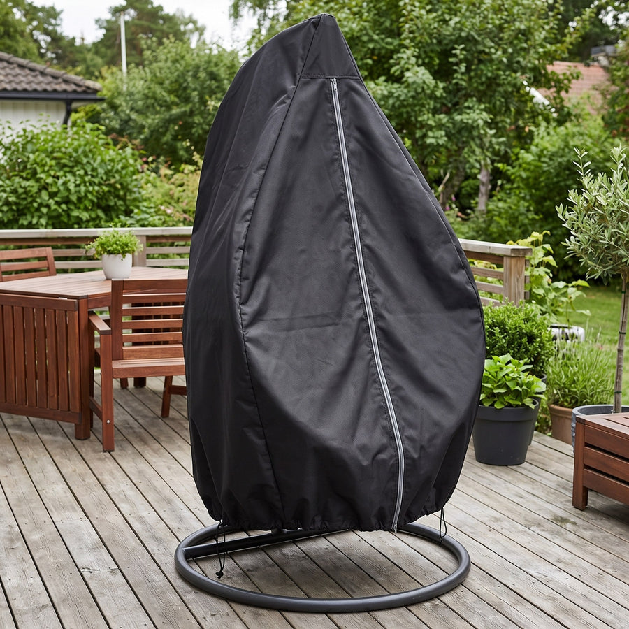 Black cover on a hanging egg chair on a wood deck