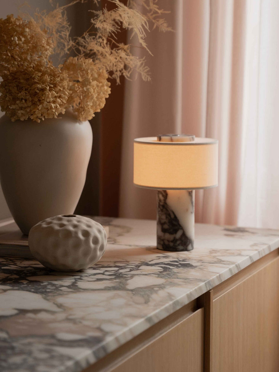 Auríe Portable Lamp with marble base and linen shade.