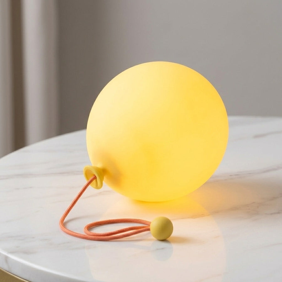 Close-up of balloon night light on a marble surface
