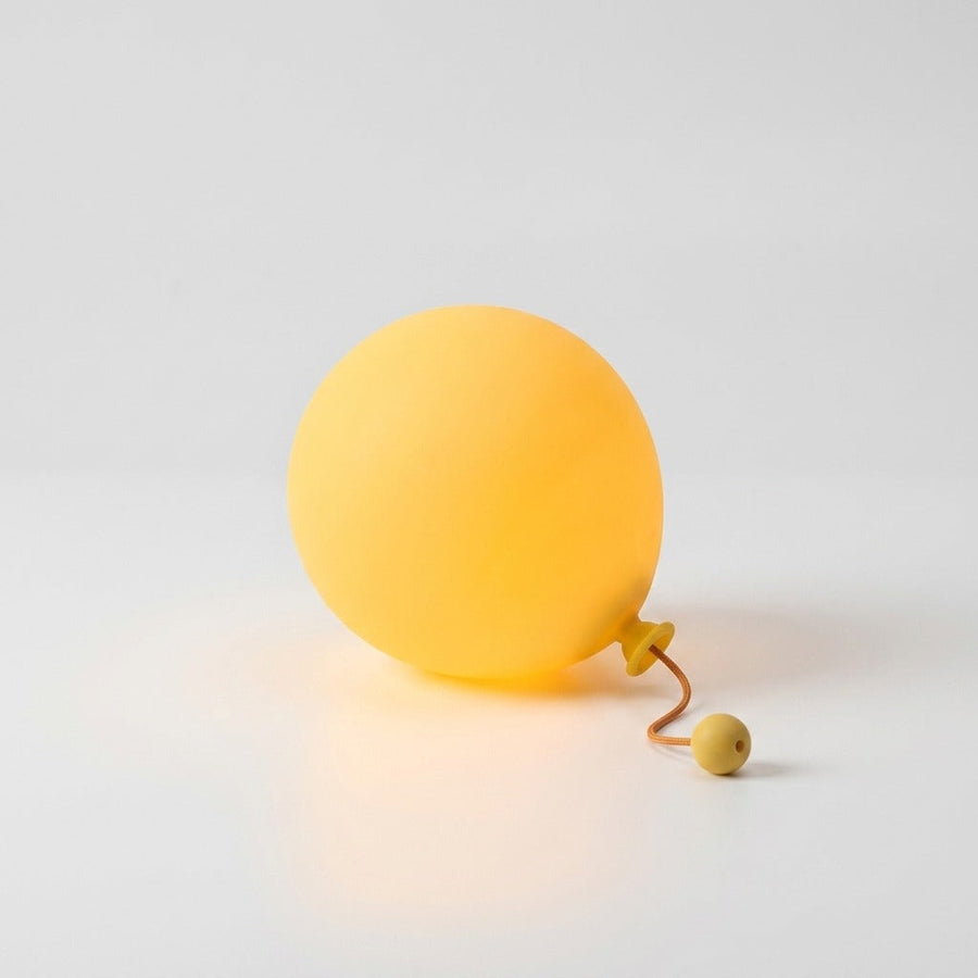 Balloon night light glowing against a white background