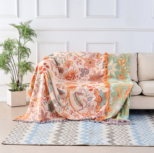 Rustic bohemian floral throw blanket draped over a couch
