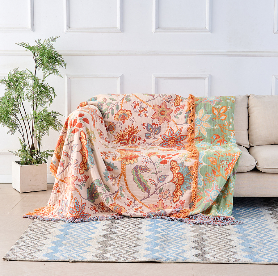 Rustic bohemian floral throw blanket draped over a couch