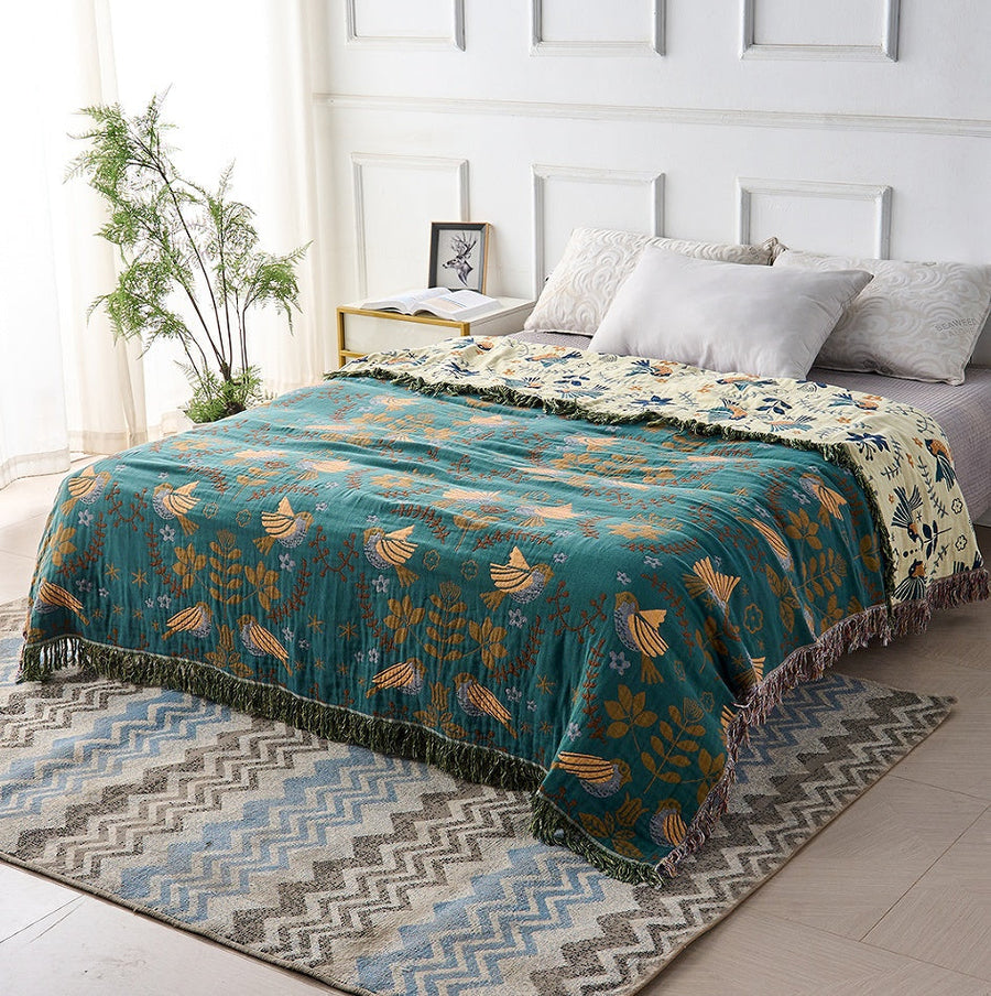 Close-up of the bird print pattern on the throw blanket