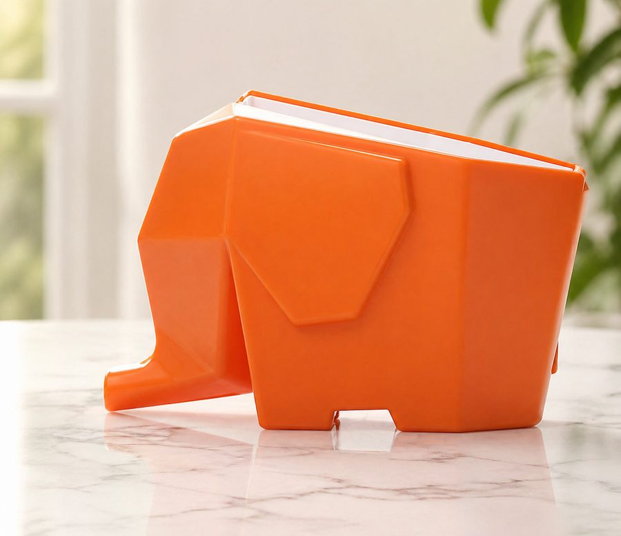 Close-up of the elephant's trunk directing water into the sink.