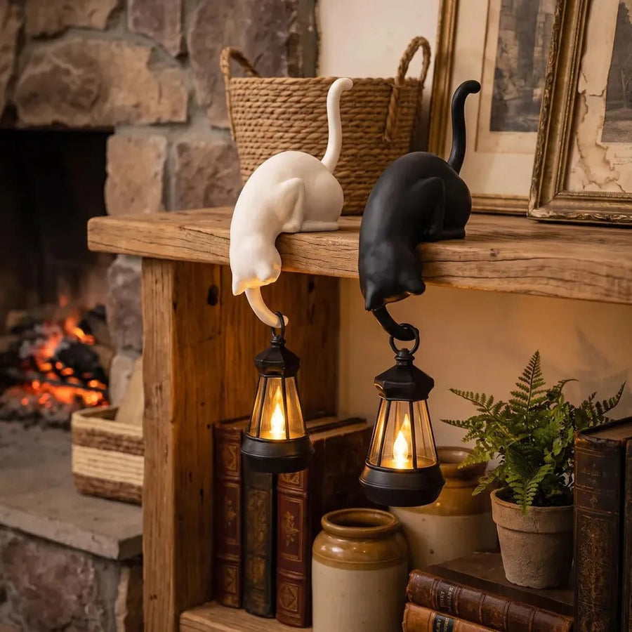 Cat figurine with hook by a fireplace – decorative shelf edge accent