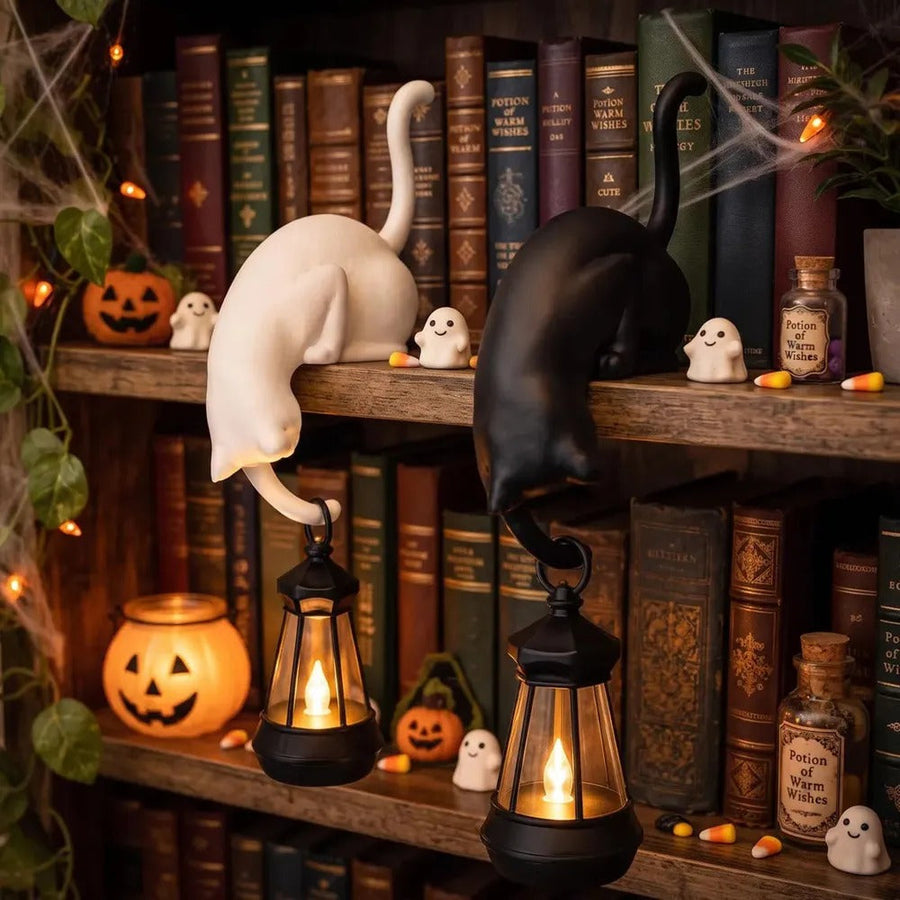 Cat figurines with lantern in Halloween style – white and black