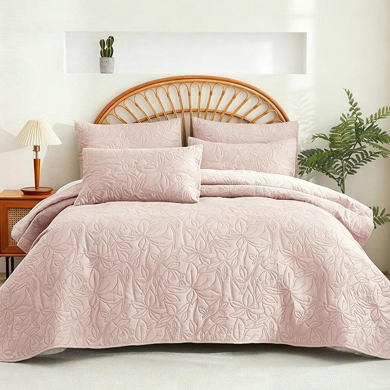 Pink quilted 4-piece bedding set with two shams and one lumbar pillow sham