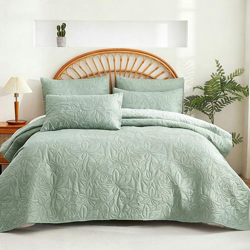 Sage green quilted floral bedding set with matching shams