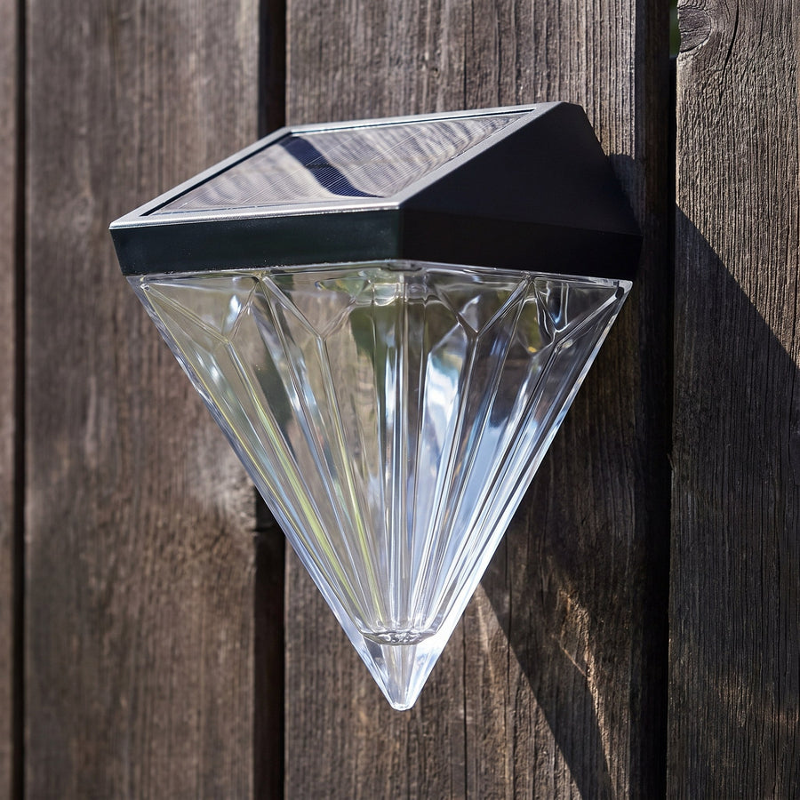 The diamond light in daylight showing the faceted crystal and solar panel