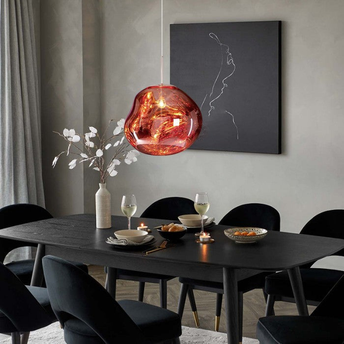 Red pendant light hanging in a modern hallway