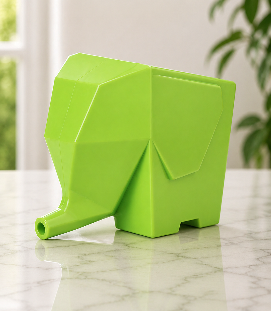 Elephant drainer holding toothbrushes and toothpaste.