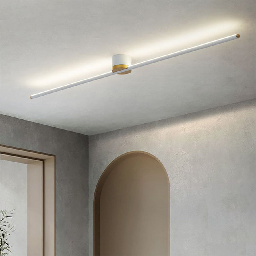 Linear LED semi-flush ceiling light glowing with warm light