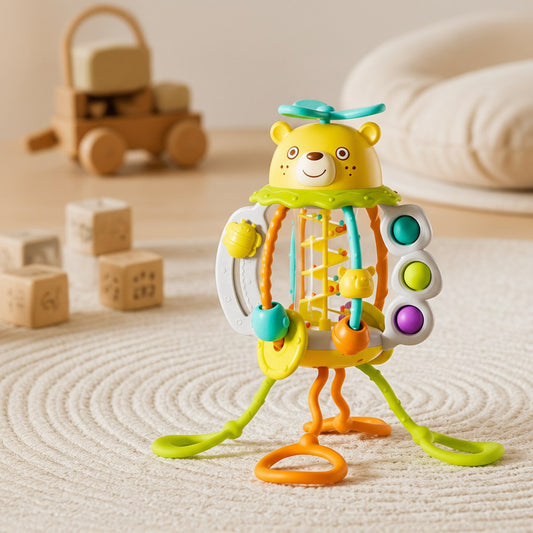 Bear activity rattle with pull cords on a rug
