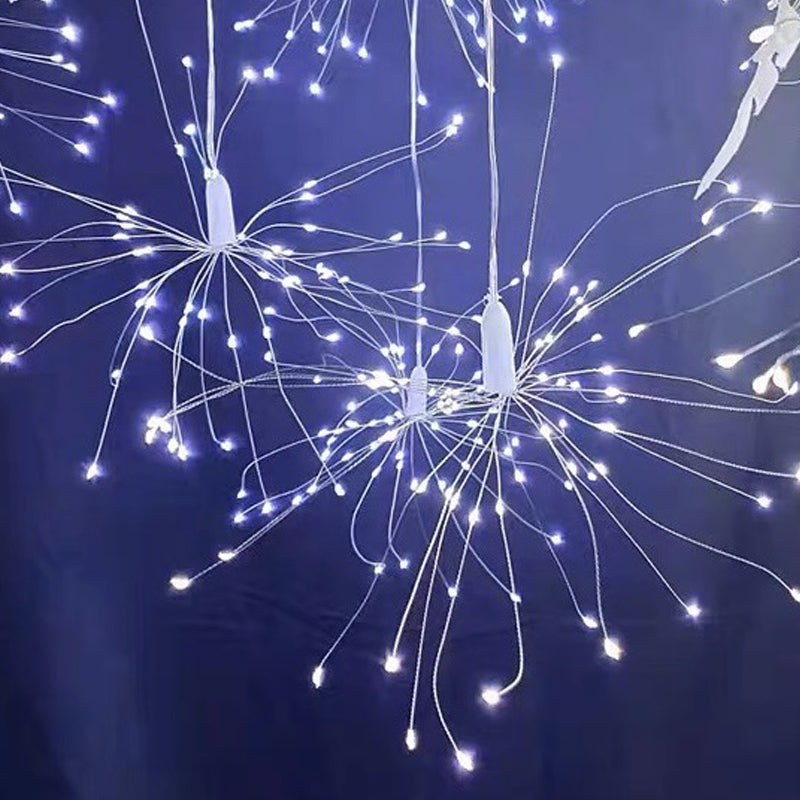 White LED star lamp hanging against blue background