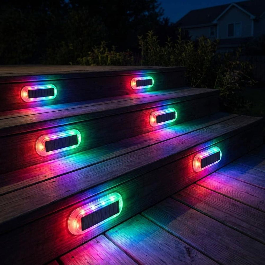 RGB colorful solar step lights on wooden deck stairs at night