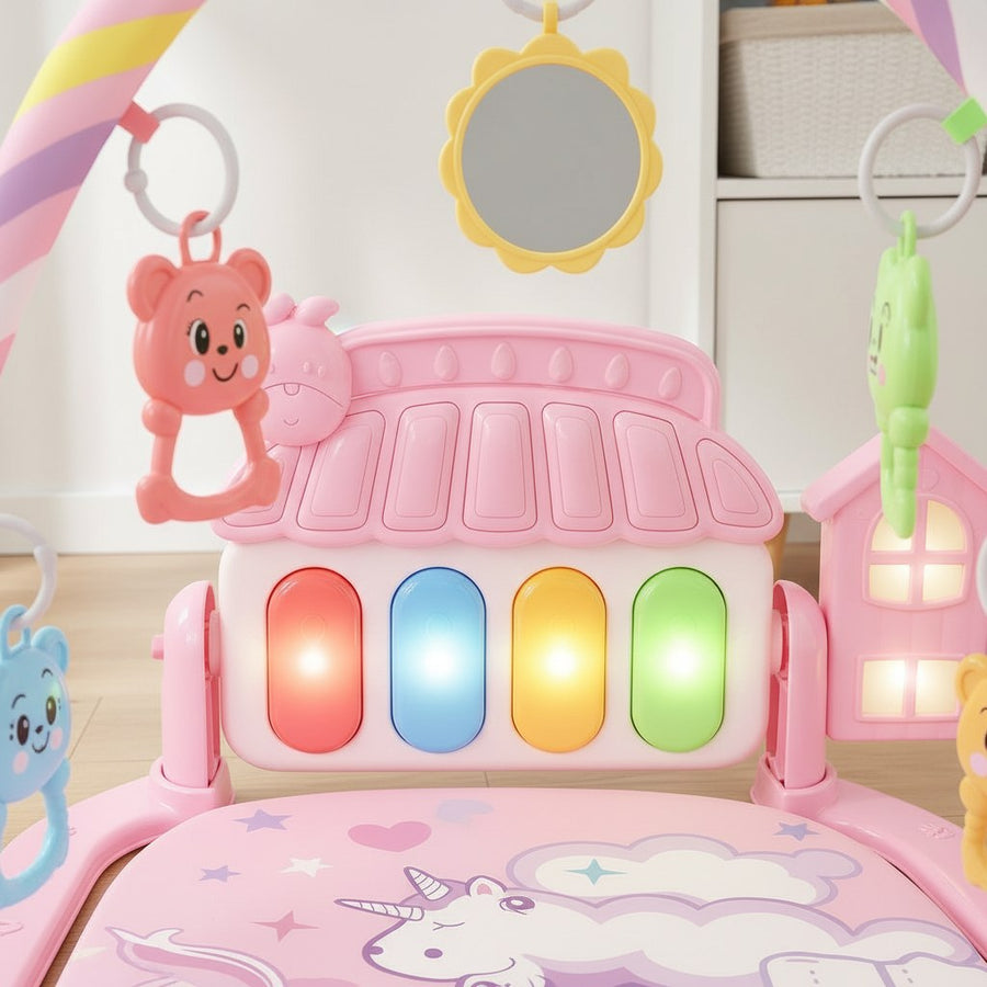 Close-up of piano keys with colorful lights and hanging toys