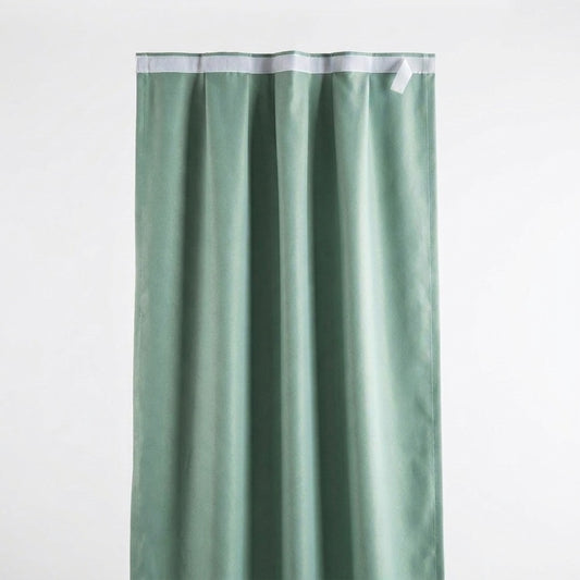 Self-adhesive blackout curtain panel in light green, adhesive strip at top