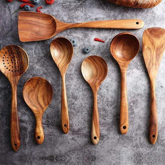 Set of 7 wooden cooking utensils on display