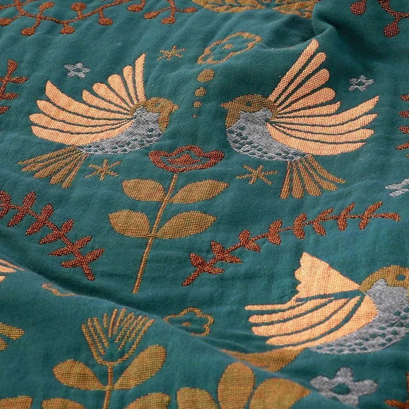 Reversible Scandinavian bird throw blanket folded to show both sides