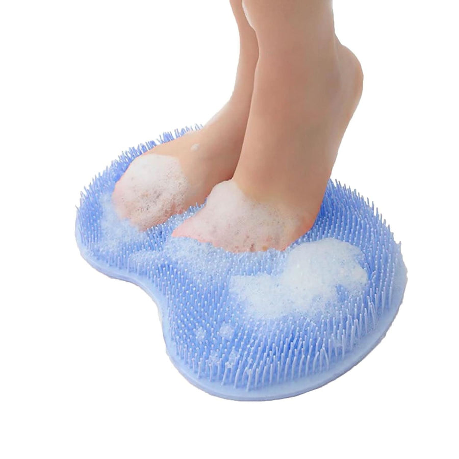 Green foot scrubber covered in soap suds - hands-free shower brush