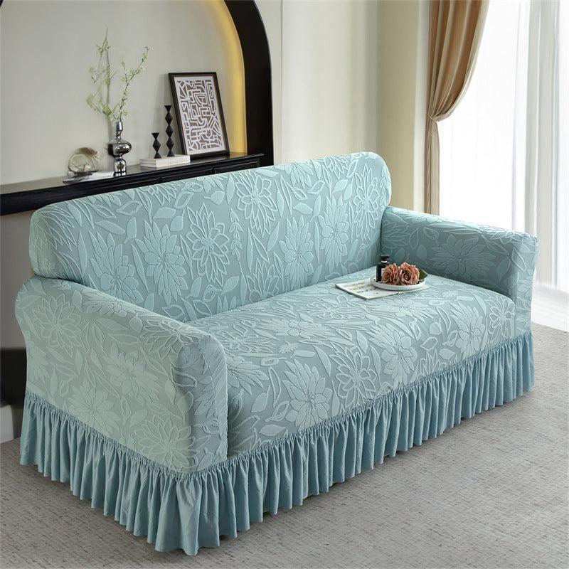 Light blue sofa slipcover with ruffled skirt in living room