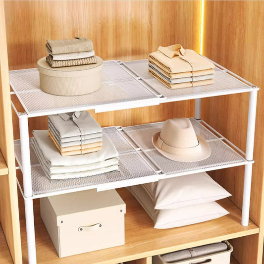 Expandable closet shelf holding folded clothes and accessories on two levels