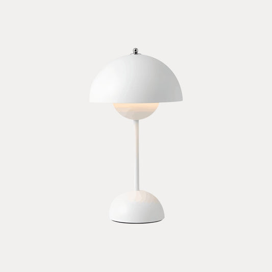 White table lamp with dome shade on a neutral background