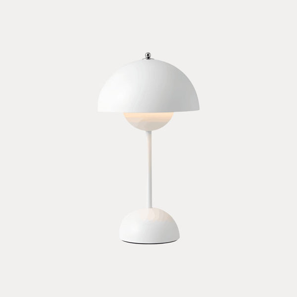 White table lamp with dome shade on a neutral background