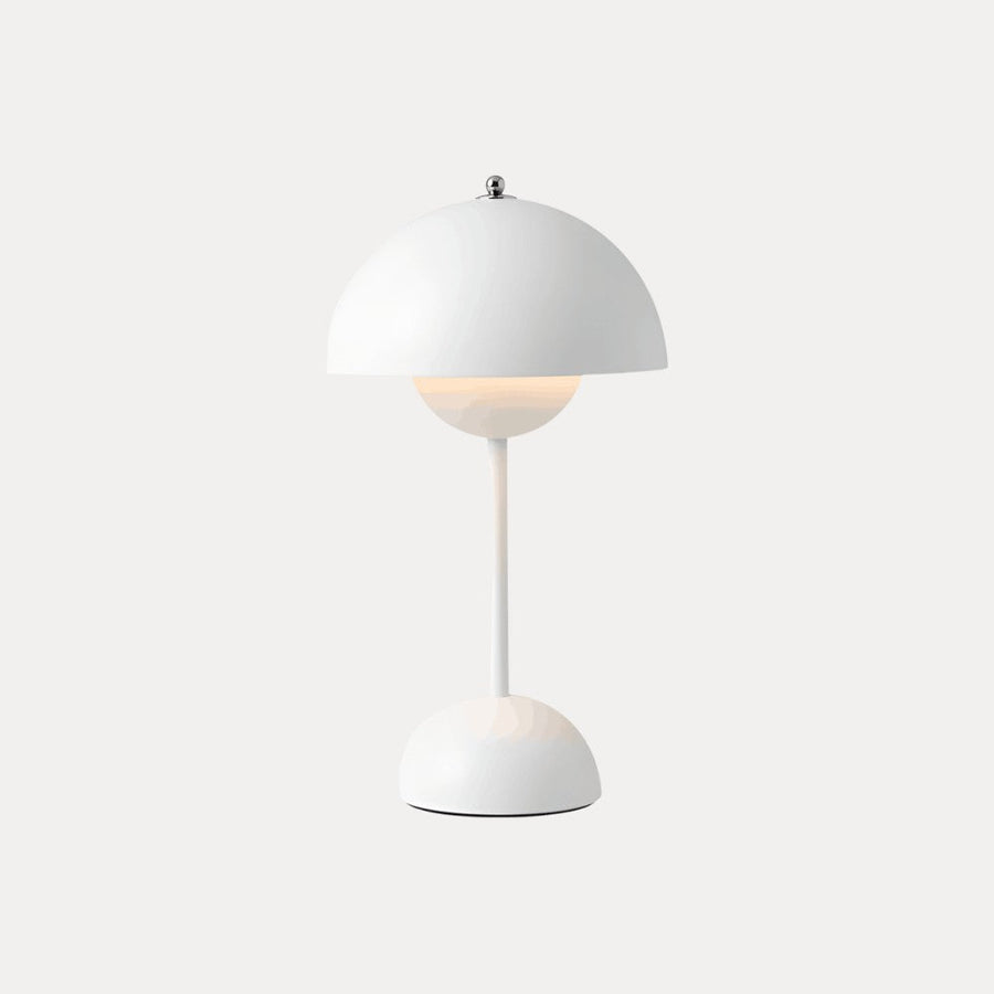 White table lamp with dome shade on a neutral background