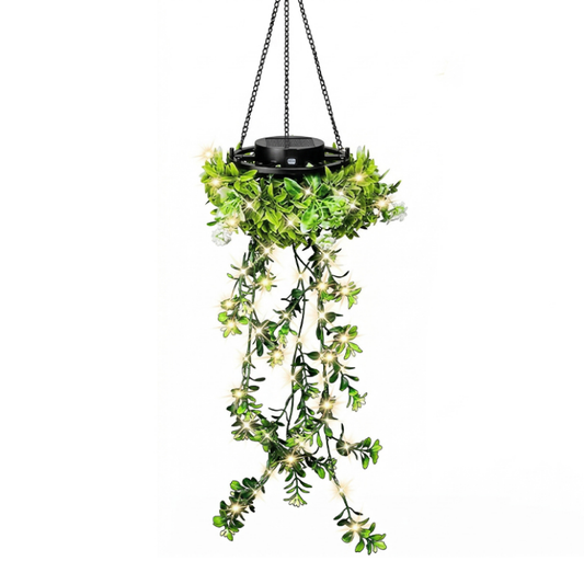 Hanging solar lantern with artificial ivy on a white background