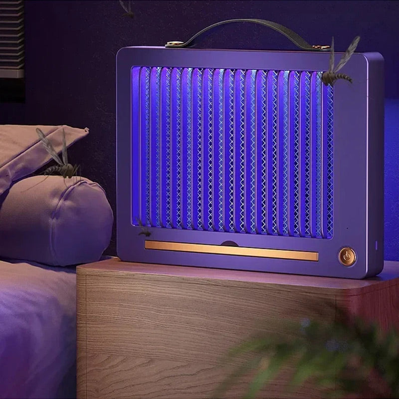 Purple electric mosquito zapper on nightstand with UV light on