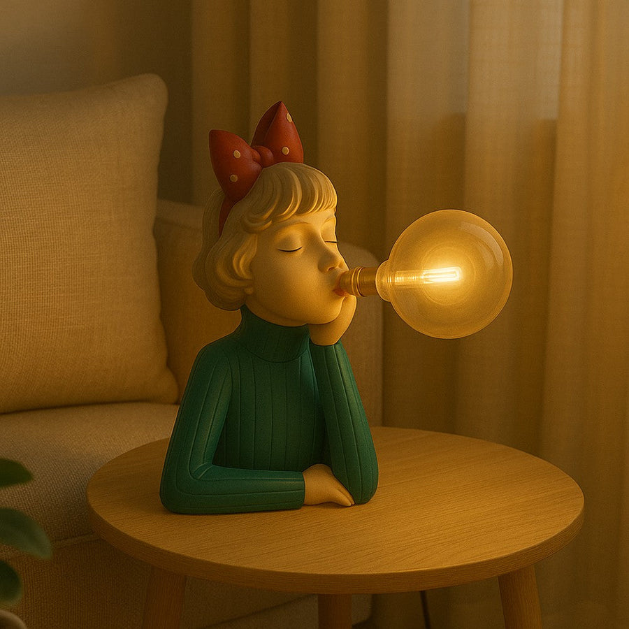 Green figurine lamp with a red bow on a coffee table