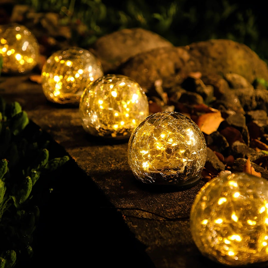 Solar globe lights along garden stones for ambiance