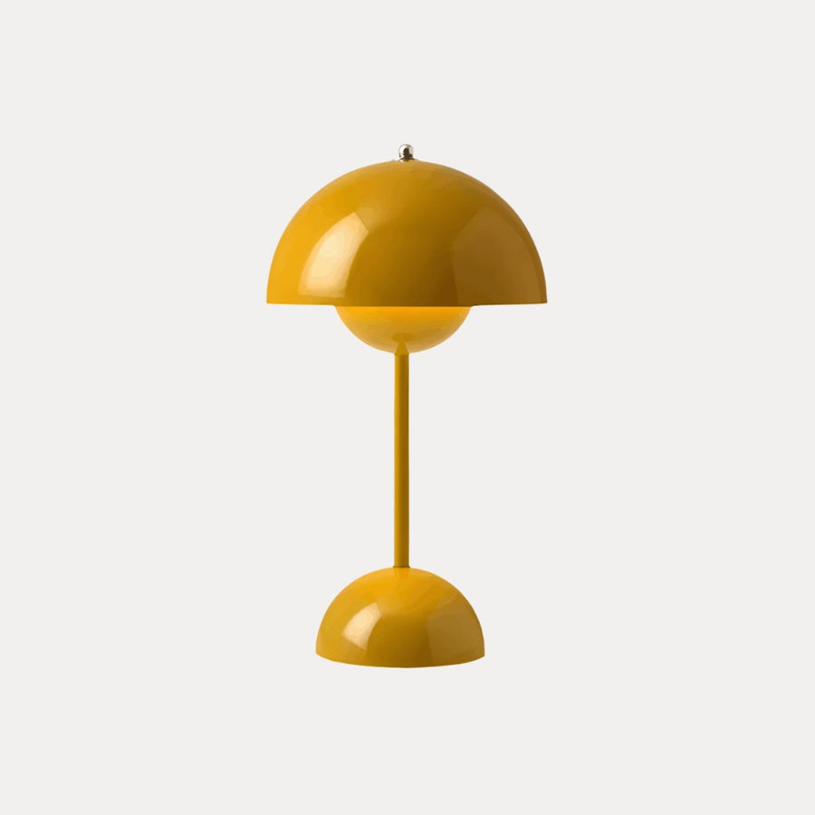 Yellow table lamp with dome shade on a neutral background