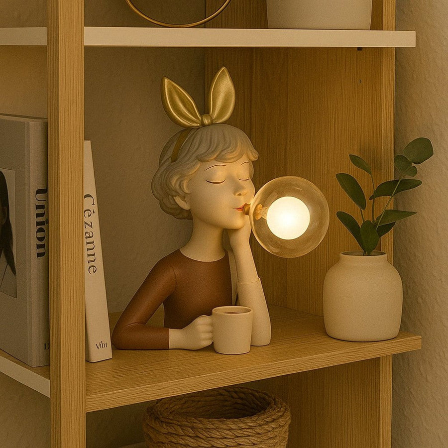 Figurine table lamp on a bookshelf with warm lighting