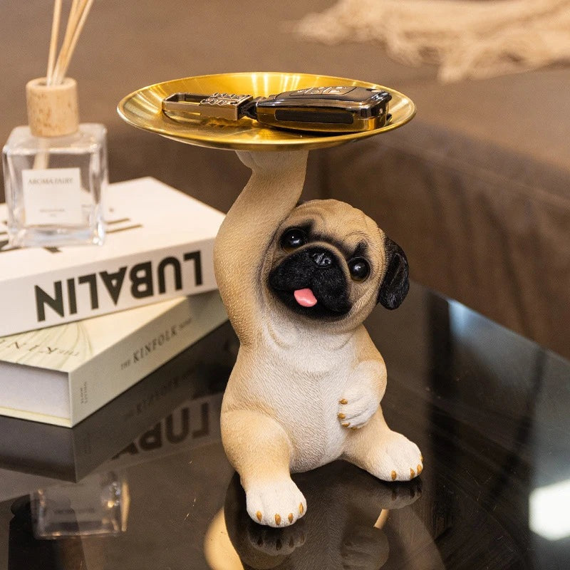 Pug statue with a tray and USB drive as entryway decor
