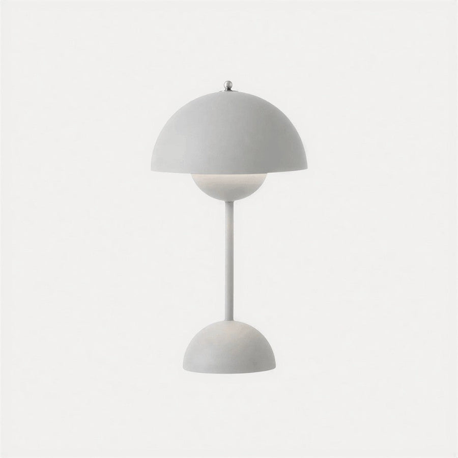 Gray table lamp with dome shade on a neutral background