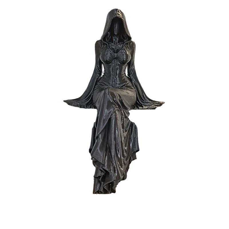 Gothic shelf-sitter statue on a white background showing detailed skirt