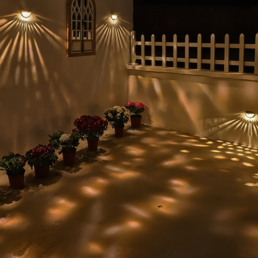 Solar-powered fence lights in a yard at night