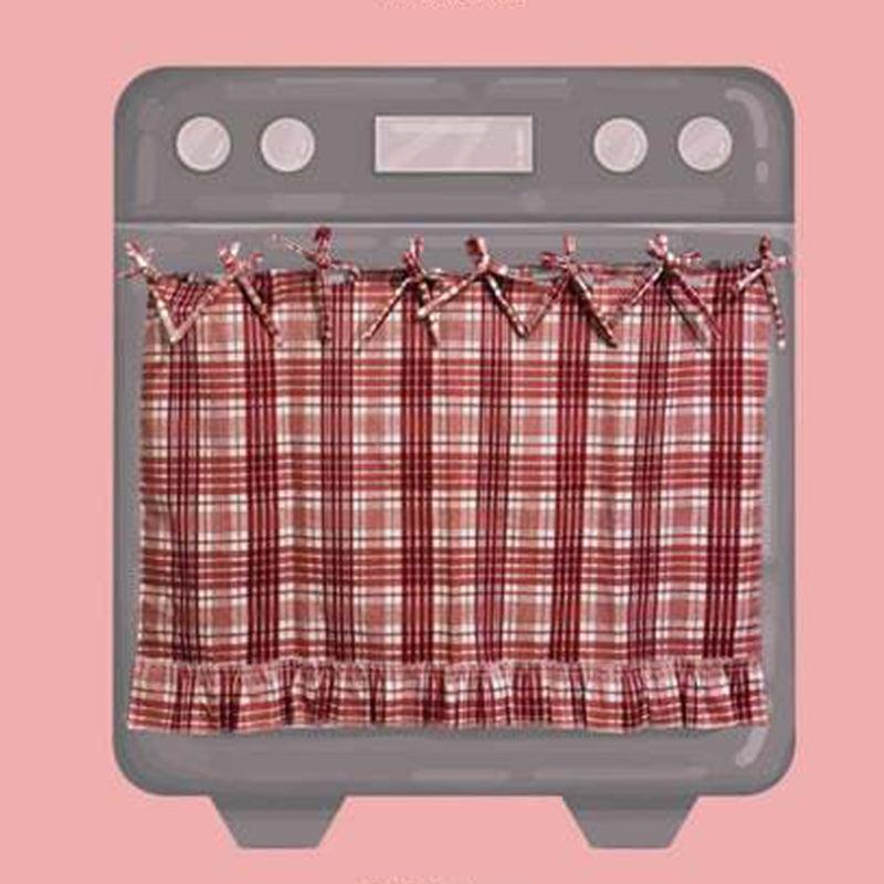 Red plaid ruffled oven door skirt with ribbon ties on oven