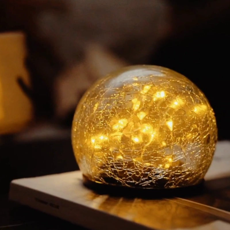 Solar globe with a warm LED glow for indoor ambiance