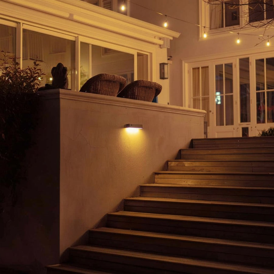 Solar wall light at an elegant home entrance