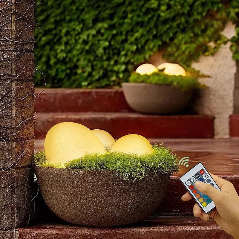 Stone-shaped garden lamp with remote control in the garden