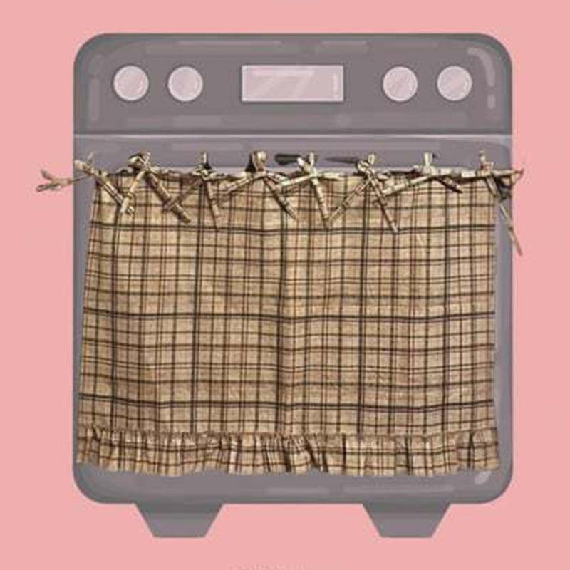 Beige plaid ruffled oven door skirt on oven with ribbon bows