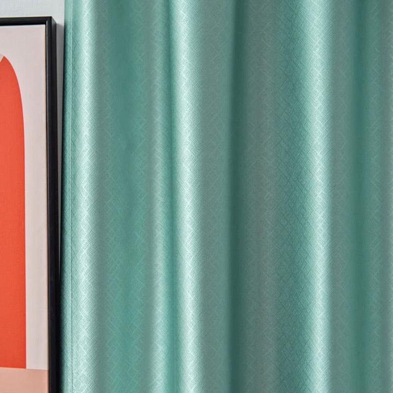 Detail shot of light green blackout curtain fabric quality and texture