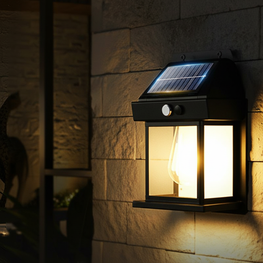 Black solar light mounted on a stone wall